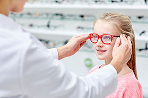 child trying on eyewear